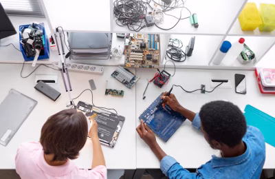 people repairing electronics